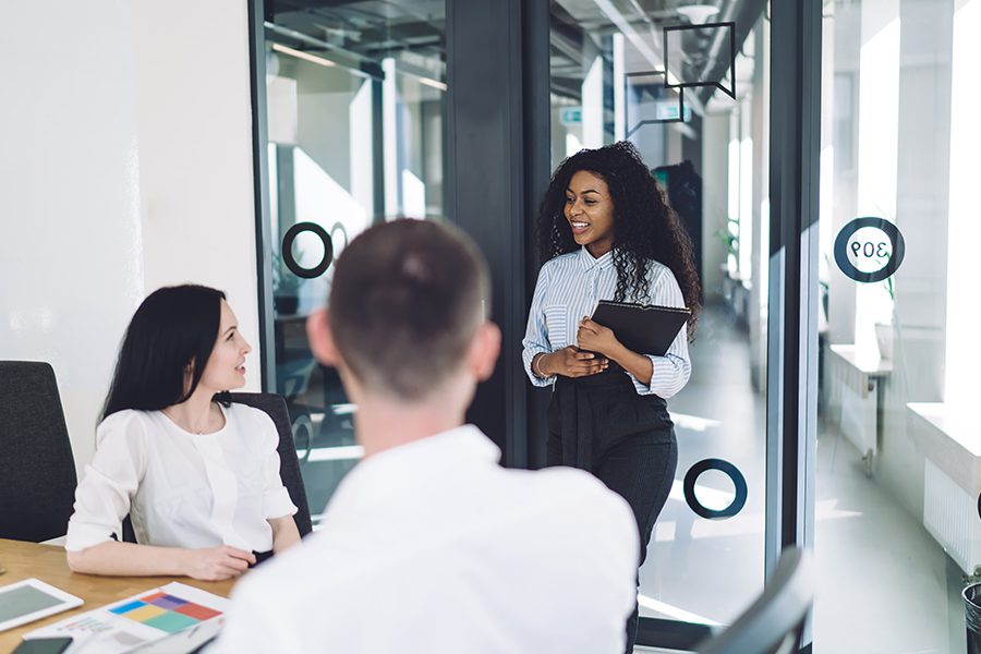 Staffing Agency Insurance - Woman Walking into the Office of a Staffing Agency