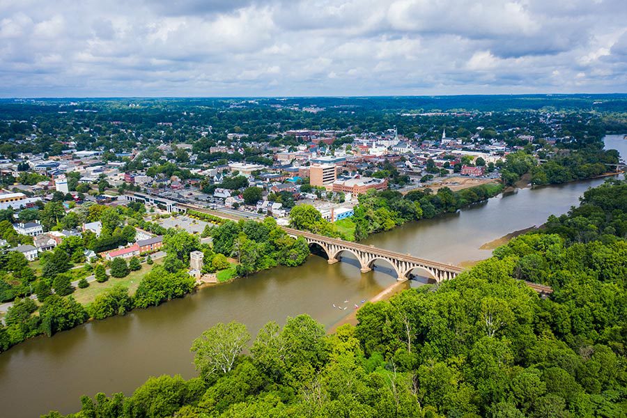 Fredericksburg, VA Insurance - Aerial View of Fredericksburg, Virginia on a Summer Day, River in the Foreground